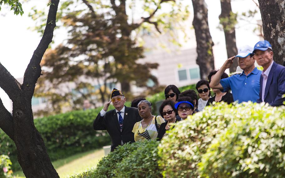 Americans and South Koreans salute the grave sites of fallen U.S. servicemembers at Yanghwajin Cemetery in Seoul, South Korea, Monday, May 28, 2018. 