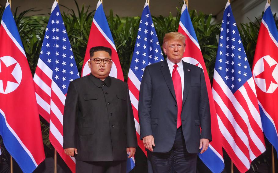 President Donald Trump and North Korean leader Kim Jong Un meet at the Capella Hotel in Singapore, Tuesday, June 12, 2018. 
