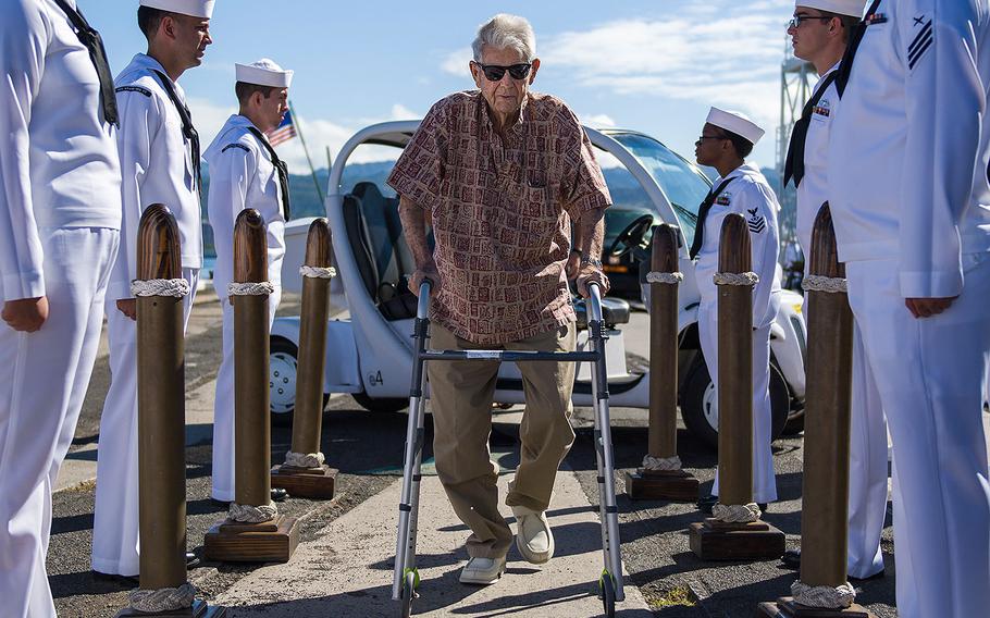 Retired Chief Boatswain's Mate and Pearl Harbor survivor Ray Emory is rendered honors by the sideboys during a farewell ceremony held before he departs Hawaii to be with family on June 19, 2018. Emory was responsible for the identification of unknown service members killed in the attacks on Pearl Harbor who were buried in unnamed graves.