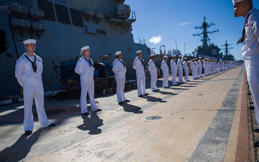 Sailors render honors to retired Chief Boatswain's Mate and Pearl Harbor survivor Ray Emory during a farewell ceremony on June 19, 2018. held at Pearl Harbor before he departs Hawaii to be with family.