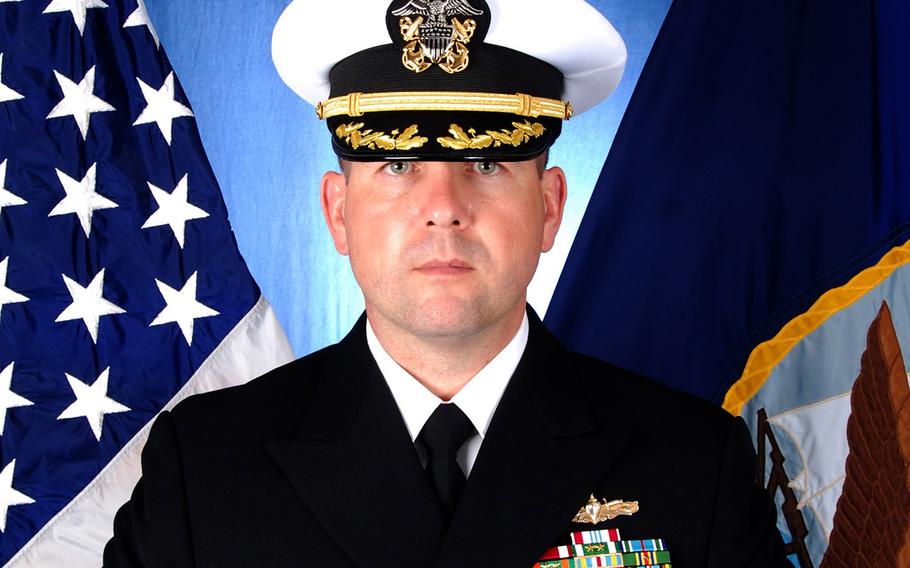 Navy Cmdr. Bryce Benson.