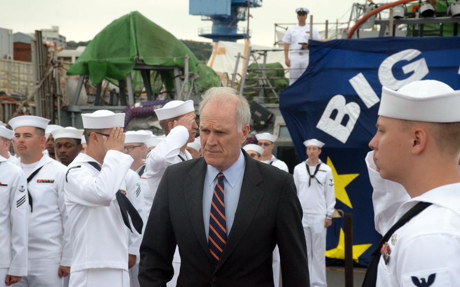 Secretary of the Navy Richard Spencer enters the USS John S. McCain’s rededication ceremony Thursday, July 12, 2018.