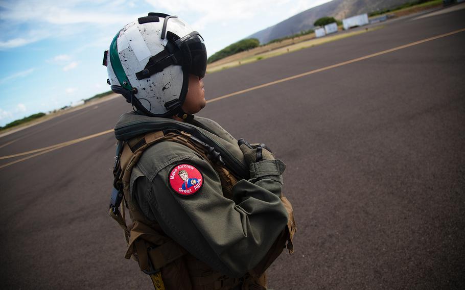 A Navy helicopter crew chief wears a "Make Aircrew Great Again" morale patch at Barking Sands Pacific Missle Range, Hawaii, July 12, 2018. 