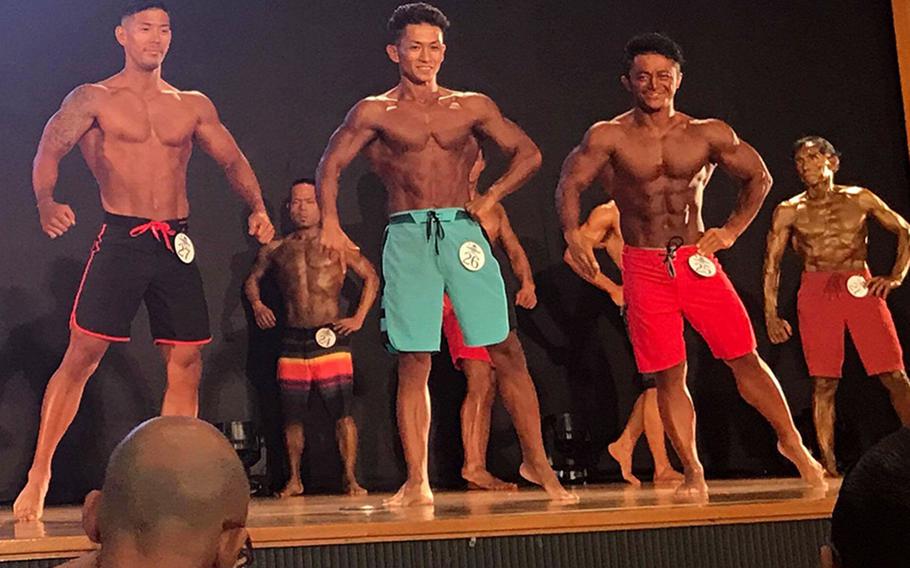 Contestants pose during the19th annual Far East Bodybuilding Competition at Camp Foster, Okinawa, Sunday, Aug. 5, 2018. 