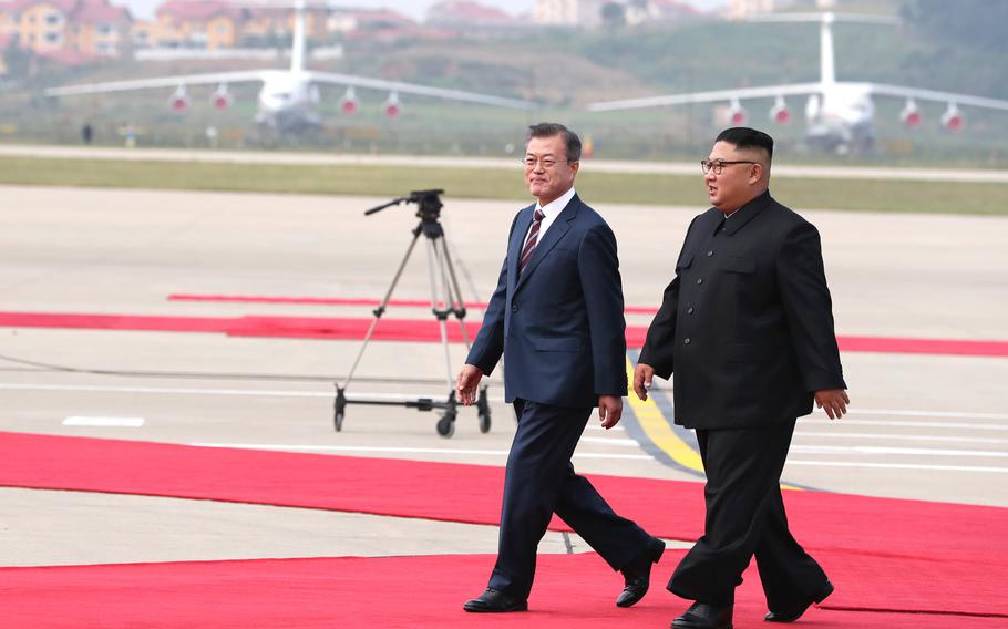 South Korean president Moon Jae-in (left) and North Korean leader Kim Jong Un meet in North Korea on Sept. 18, 2018. 