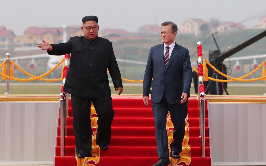 South Korean president Moon Jae-in (right) and North Korean leader Kim Jong Un meet in North Korea on Sept. 18, 2018. 