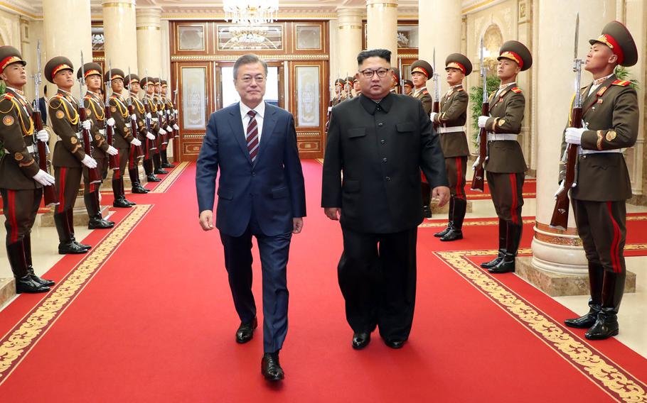 South Korean president Moon Jae-in (left) and North Korean leader Kim Jong Un arrive at the headquarters of the Central Committee of the Workers' Party of Korea in Pyeongyang, North Korea on Sept. 18, 2018. 