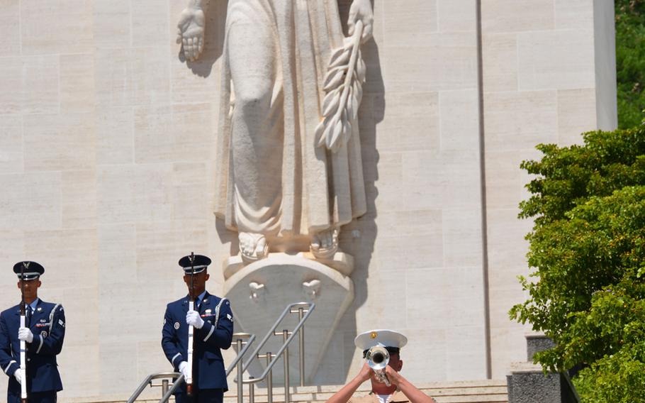 Taps is played near the Court of Honor’s Lady Liberty statue at the National Memorial Cemetery of the Pacific during the conclusion of a ceremony recognizing National POW/MIA Recognition Day Sept. 21, 2018.