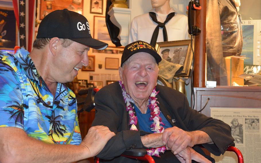 World War II veteran Sidney Walton, shown at the age of 99, and son Paul share a laugh during a stop at the Home of the Brave Museum, Honolulu, Oct. 5, 2018, shortly after meeting with Hawaii Gov. David Ige.