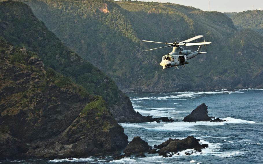 A Marine Corps UH-1Y Venom flies toward Camp Schwab, Okinawa, Nov. 9, 2017. 