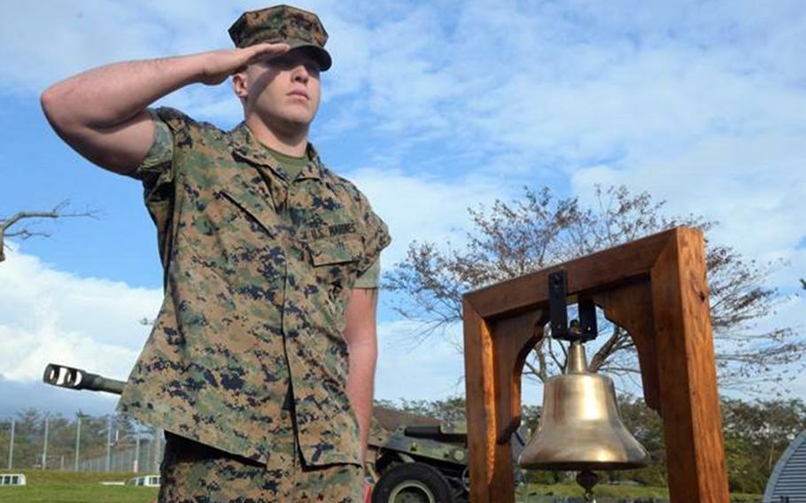A Marine salutes during a remembrance ceremony Friday, Oct. 19, 2018, for 13 Marines killed in a fire at Camp Fuji, Japan, in October 1979.