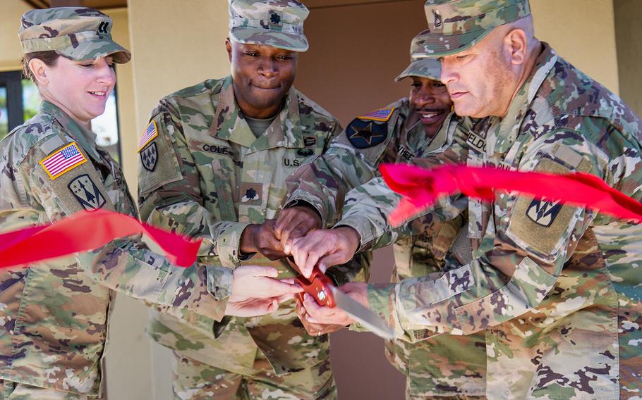 A ribbon is cut to celebrate the opening of the new home of Delta Battery, 2nd Air Defense Artillery Regiment at Camp Carroll, South Korea, Friday, Oct. 19, 2018. 