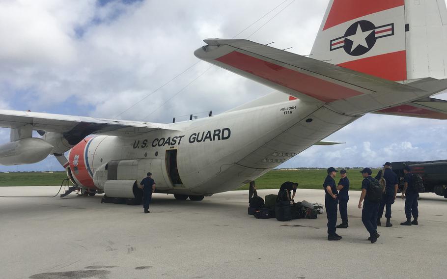 A Coast Guard crew prepares to fly an HC-130 cargo plane from Hawaii to the Mariana Islands Thursday, Oct. 25, to assist with relief efforts and storm assessments in the wake of Typhoon Yutu.