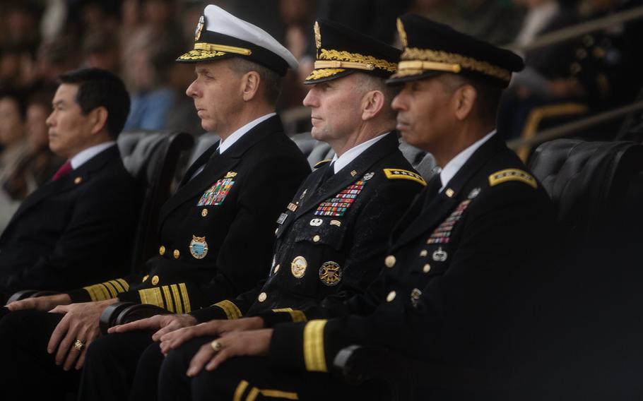 Incoming U.S. Forces Korea commander Robert Abrams, center, sits between Adm. Phil Davidson, left, Indo-Pacific Command leader, and outgoing USFK commander Gen. Vincent Brooks, at Camp Humphreys, South Korea, Thursday, Nov. 8, 2018.