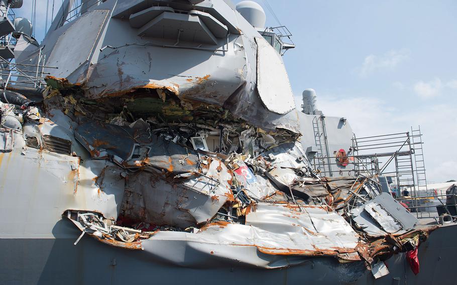 In a July 13, 2017, photo, the USS Fitzgerald sits in Dry Dock 4 at Fleet Activities Yokosuka, Japan, to continue repairs and assess damage sustained from its collision with a merchant vessel.