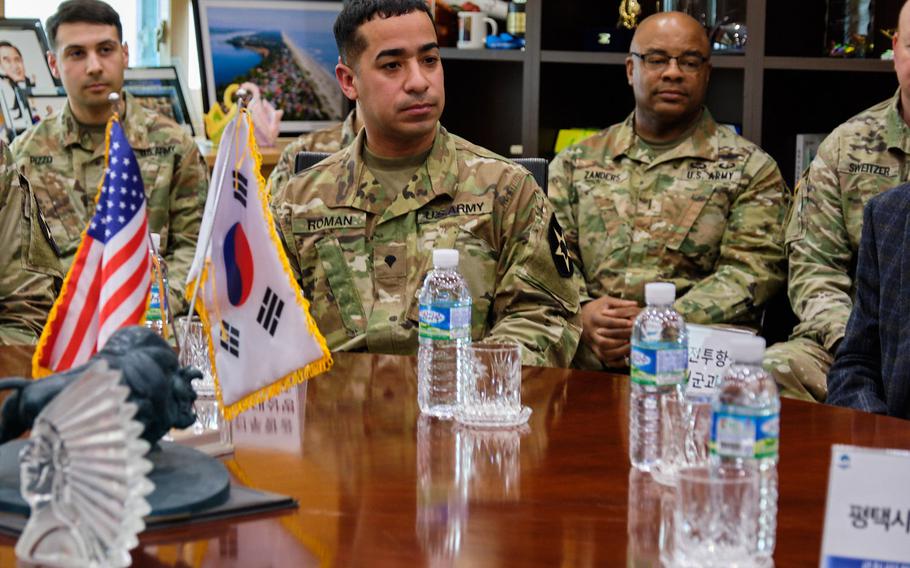Army Spc. Jonathan Roman Rios, center, is honored for saving a local girl from a dog attack duing a ceremony at Pyeongtaek City Hall, Pyeongtaek, South Korea, Thursday, March 28, 2019.
