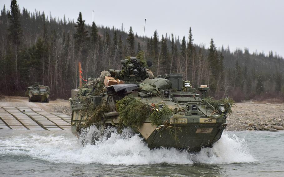 Strykers from the 1st Stryker Brigade Combat Team, 25th Infantry Division, cross Jarvis Creek in the Alaska's Donnelly Training Area Oct. 19, 2018, during Arctic Anvil 19-01. 