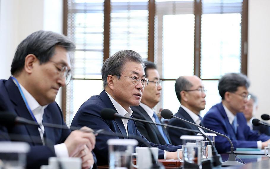 South Korean President Moon Jae-in, second from left, speaks during a meeting of senior aides in Seoul, South Korea, Monday, April 15, 2019.