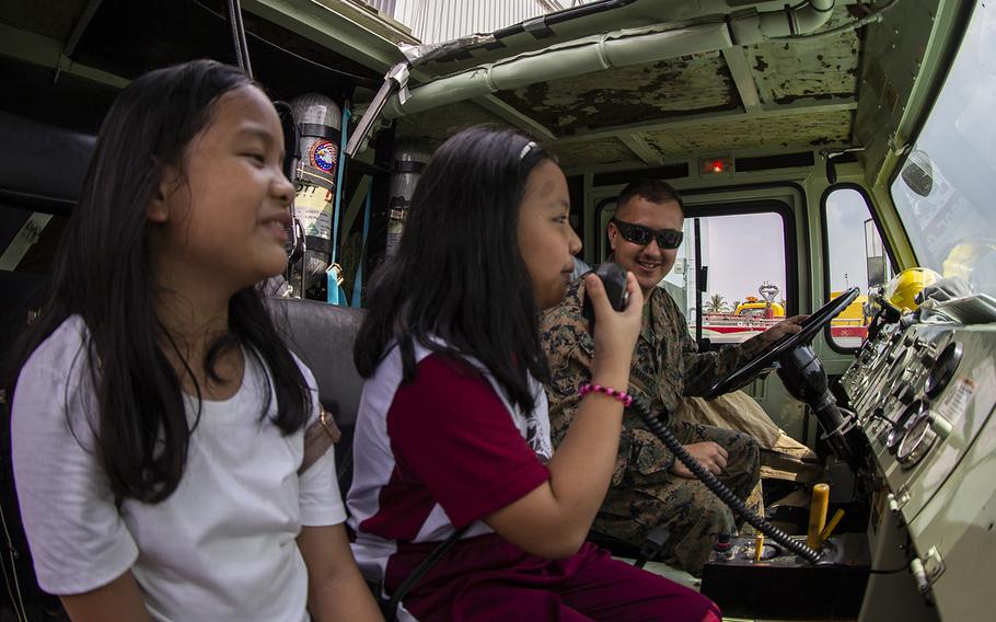 Local students tour a military fire truck during the Balikatan exercise at Clark Air Base, Philippines, April 6, 2019. 