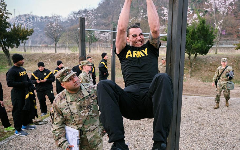 A soldier assigned to 2nd Infantry Division performs the leg tuck during the Best Warrior Competition at Camp Casey, South Korea, on April 18, 2019.