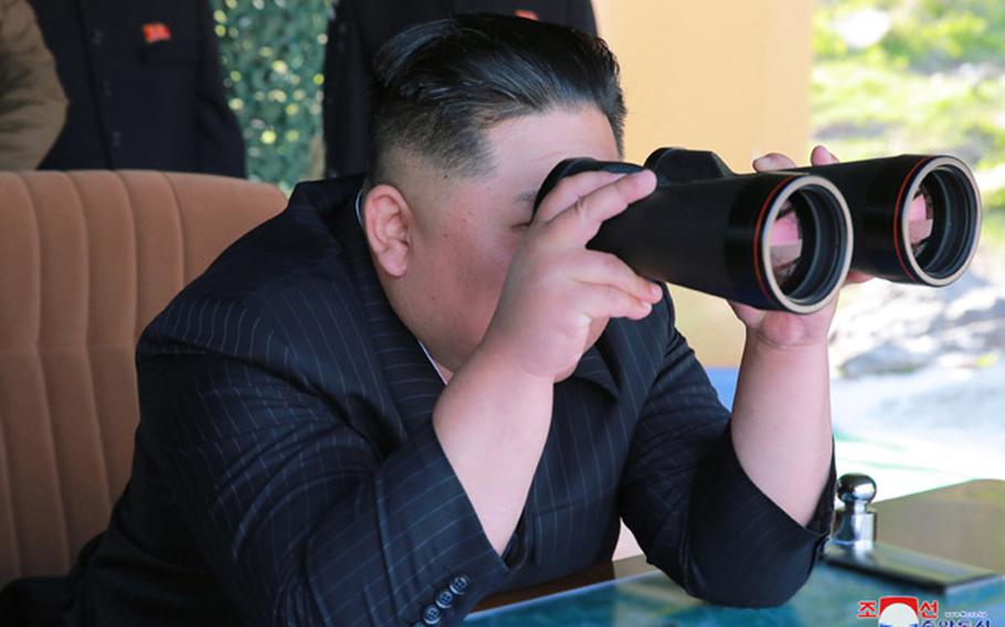 In this undated file photo released May 10, 2019 by the state-run Korean Central News Agency, North Korean leader Kim Jong Un observes a missile launch.