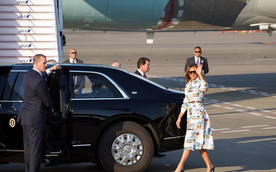 First lady Melania Trump waves to a crowd after landing with President Donald Trump at Haneda International Airport in Tokyo, Saturday, May 25, 2019.