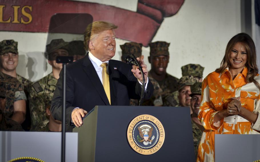 President Donald Trump speaks to servicemembers aside first lady Melania Trump aboard the USS Wasp at Yokosuka Naval Base, Japan, Tuesday, May 28, 2019. 