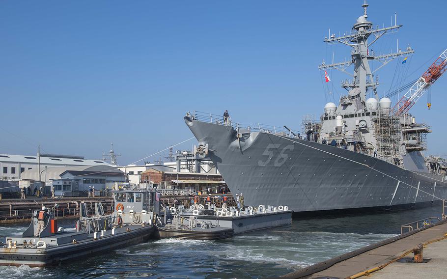 The guided missile destroyer USS John S. McCain is prepared to leave dry dock at Yokosuka Naval Base, Japan, Nov. 27, 2018. 
