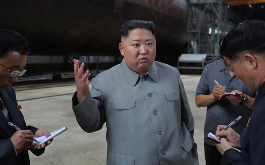 North Korean leader Kim Jong Un inspects a new submarine in this undated photo from the state-run Korean Central News Agency.