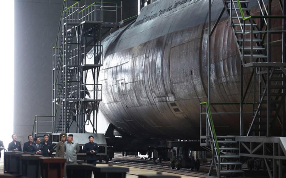 North Korean leader Kim Jong Un inspects a new submarine in this undated photo from the state-run Korean Central News Agency. 