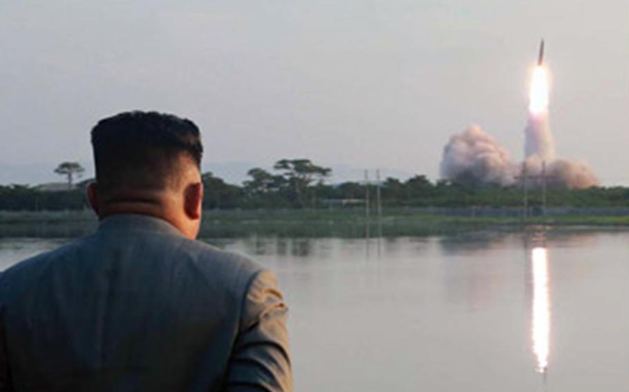 North Korean leader Kim Jong Un watches a missile launch in this undated photo released by the Korean Central News Agency, Friday, July 26, 2019. 