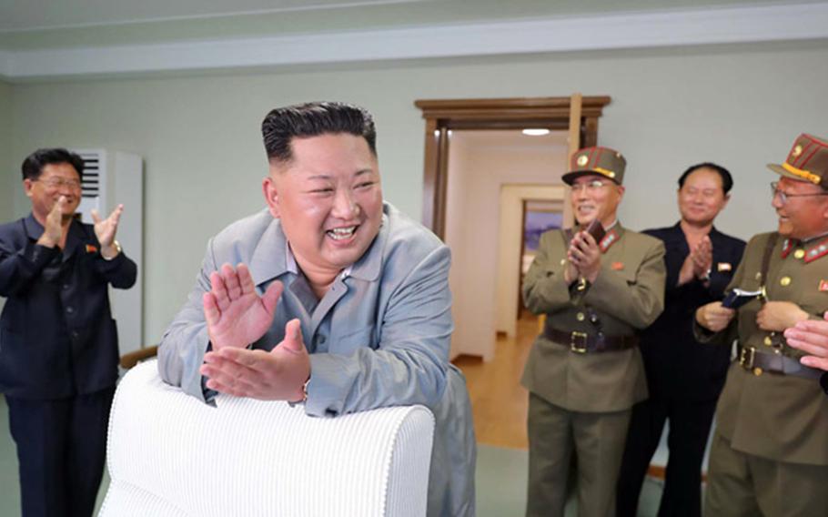 North Korean leader Kim Jong Un celebrates in this undated photo released by the Korean Central News Agency, Friday, July 26, 2019.