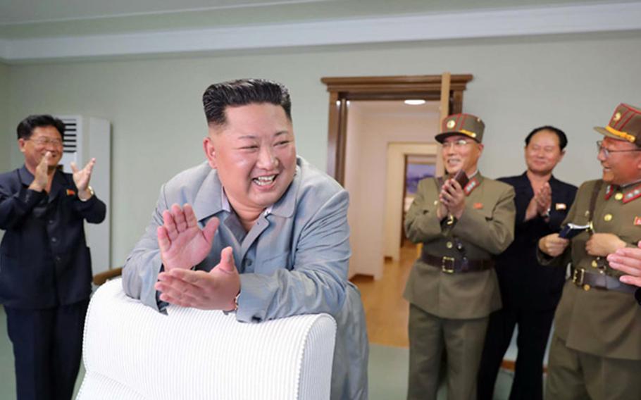 North Korean leader Kim Jong Un celebrates in this undated photo released by the Korean Central News Agency, Friday, July 26, 2019. 