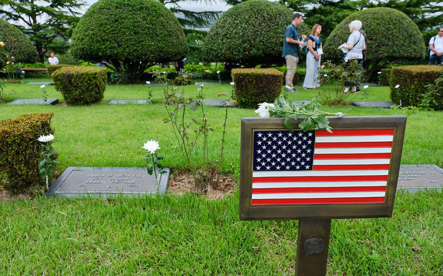 Korean War veterans placed white flowers on the headstones of fallen U.S. servicemembers during a visit to the United Nations Memorial Cemetery in Busan, South Korea, Thursday, July 25, 2019.
