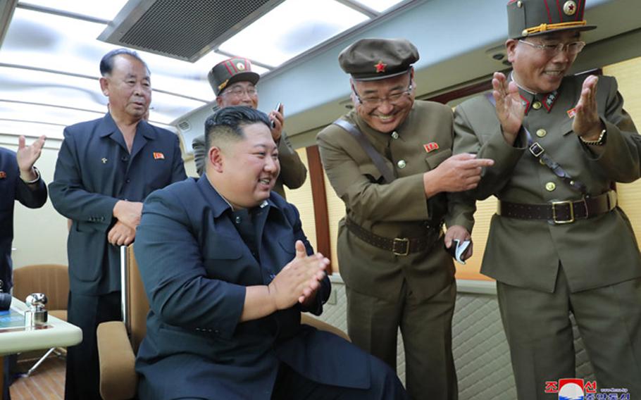 This undated photo, released by the state-run Korean Central News Agency on Aug. 17, 2019, shows North Korean leader Kim Jong Un observing the test-firing of a "new weapon," according to KCNA.