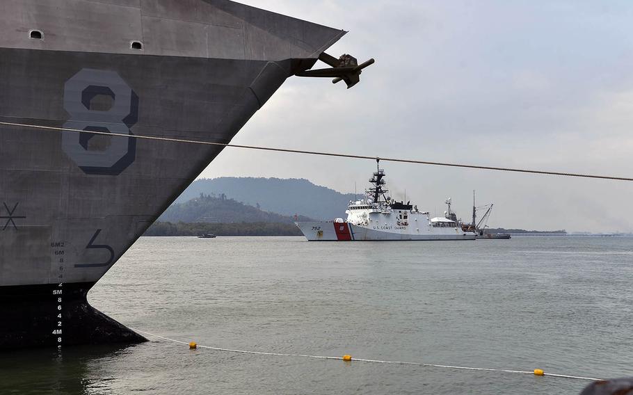 The U.S. Coast Guard cutter Stratton prepares to moor near the USS Montgomery at Lumut Naval Base, Malaysia, on Tuesday, Aug. 13, 2019.

