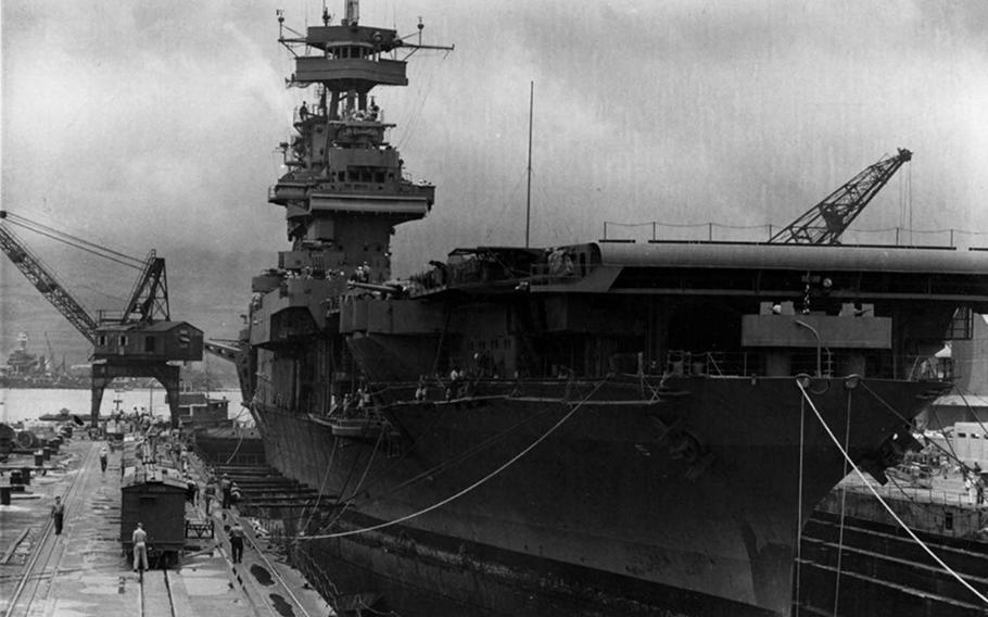 USS Yorktown undergoing repairs in Dry Dock 1 at the Pearl Harbor Navy Yard on May 29, 1942, the day before setting sail for Midway Island.