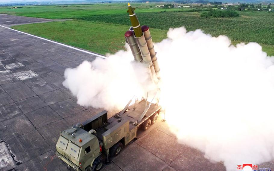 North Korea shows the launch of what it called a "super-large multiple rocket launcher system" that was observed by leader Kim Jong Un. 