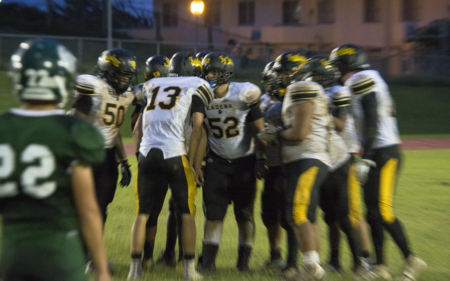 Players from the Kadena Panthers huddle during the first football game of the season against and the Kubasaki Dragons at Mike Petty Stadium on Camp Foster, Okinawa, Japan, Saturday, Sept. 7, 2019. 