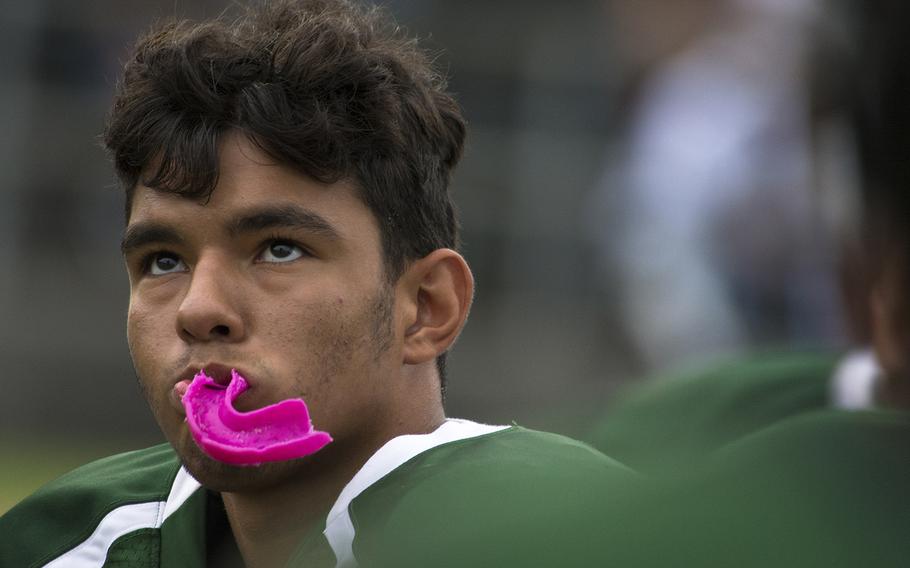 A player from the Kubasaki Dragons listens to a coach speak during the first football game of the season against the Kadena Panthers at Mike Petty Stadium on Camp Foster, Okinawa, Japan, Saturday, Sept. 7, 2019. 