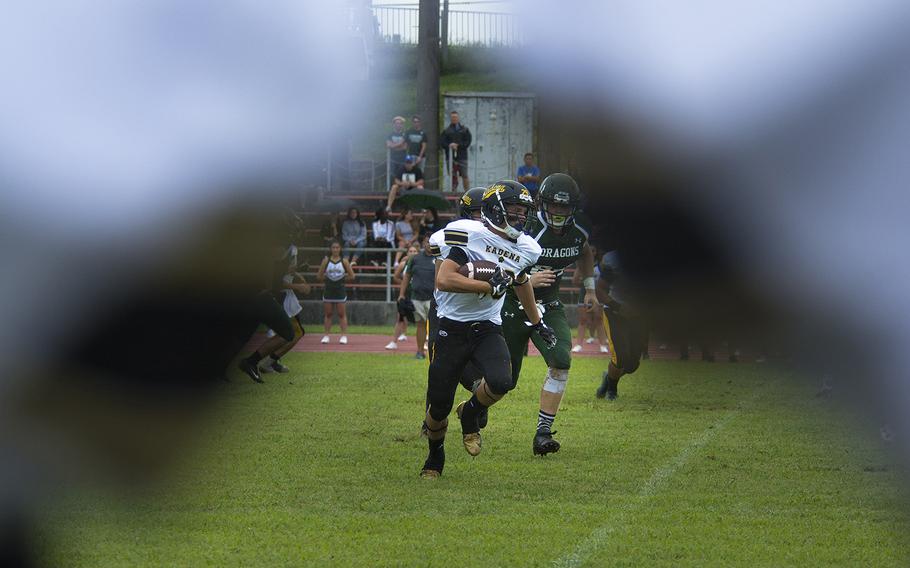 A player from the Kadena Panthers runs the ball during the first football game of the season against and the Kubasaki Dragons at Mike Petty Stadium on Camp Foster, Okinawa, Japan, Saturday, Sept. 7, 2019. 