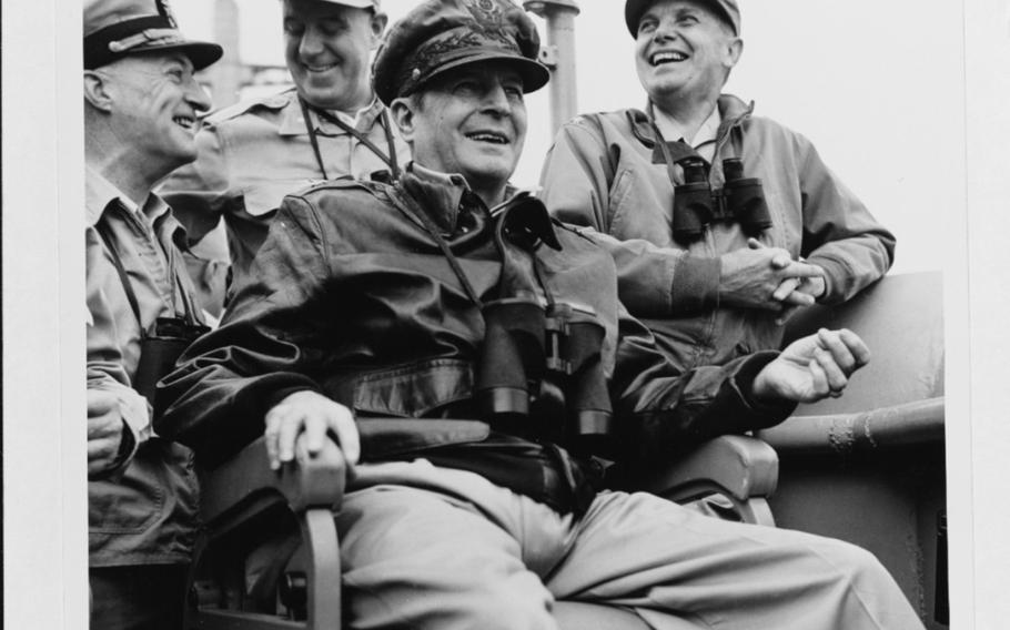 Gen. Douglas MacArthur, center, is shown on board USS Mount McKinley during the Incheon landings on Sept. 15, 1950. 