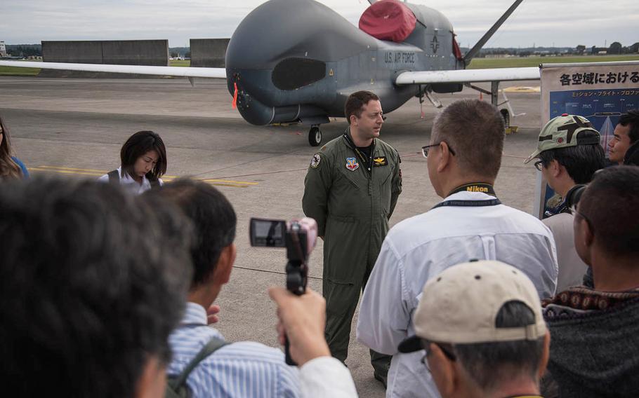 Maj. John Wright, a spokesman for the U.S. Air Force 319th Operations Group, answers questions about the RQ-4 Global Hawk at the annual Yokota Air Base, Japan, Friendship Festival on Saturday, Sept. 14, 2019.  