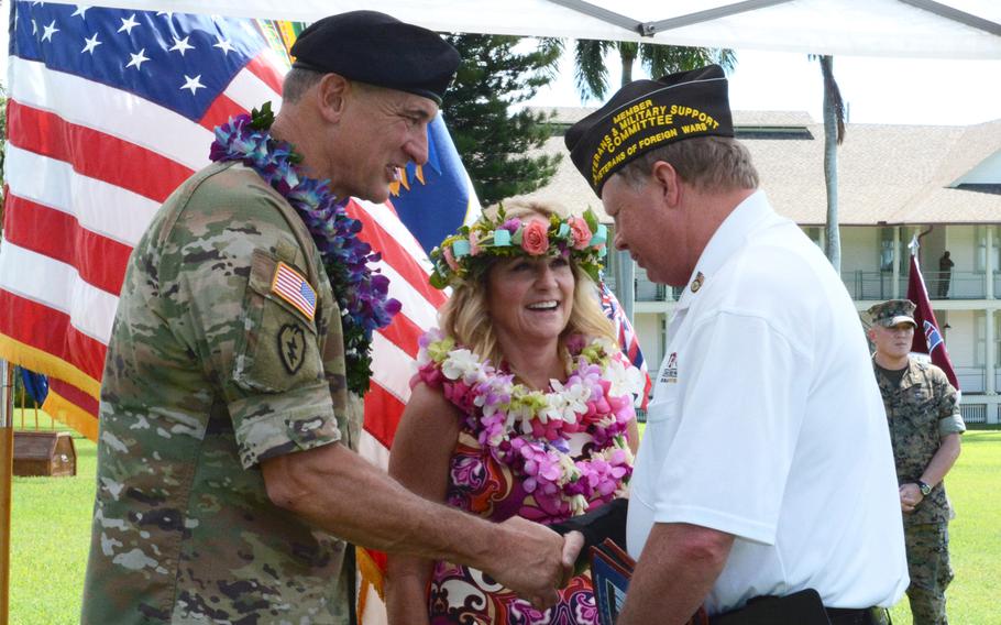 Gen. Robert Brown, commander of U.S. Army Pacific, and his wife Patti, greet Joseph Bragg Friday, Sept. 27, 2019, after the general's farewell ceremony at Fort Shafter, Hawaii.