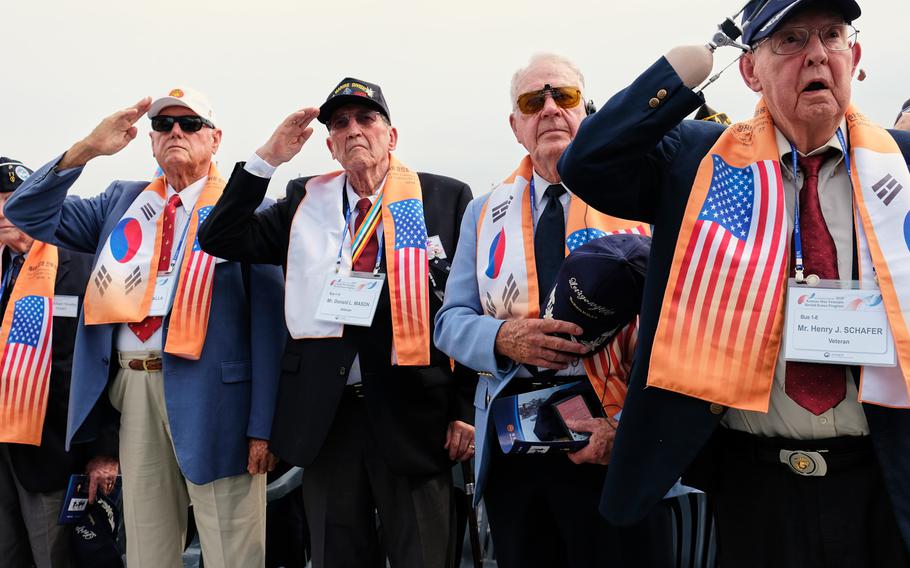 Korean War veterans salute as the U.S. national anthem is played during a ceremony marking the 69th anniversary of the Battle of Chosin Reservoir in Seoul, South Korea, Friday, Sept. 27, 2019.