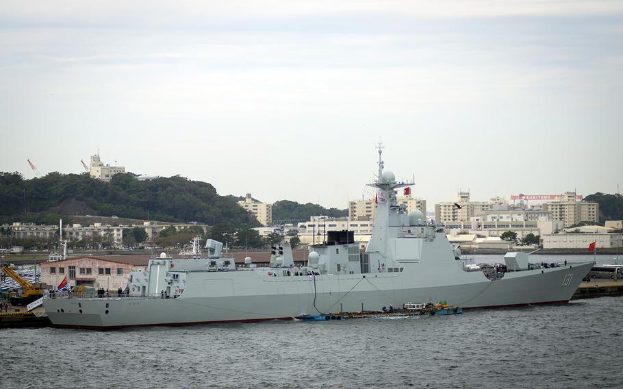 The Chinese destroyer Taiyuan anchors at Yokosuka Port, less than a mile from Yokosuka Naval Base, Japan, Thursday, Oct. 10, 2019. The ship was scheduled to participate in Japan's international fleet review, which has been canceled after Typhoon Hagibis.