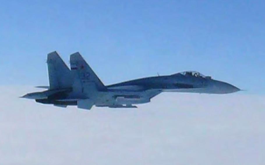 A Russian fighter jet SU-27 flies over the sea off the Japanese island of Hokkaido on Feb. 7, 2013.