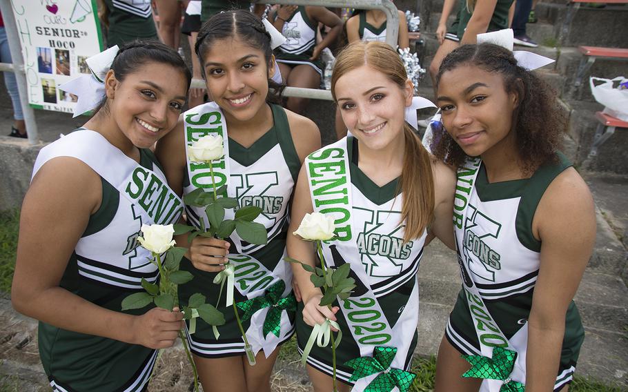 Senior cheerleaders from Kubasaki High School pose before the Dragons' game against the Camp Humphreys Blackhawks at Camp Foster, Friday, Oct. 25, 2019. 