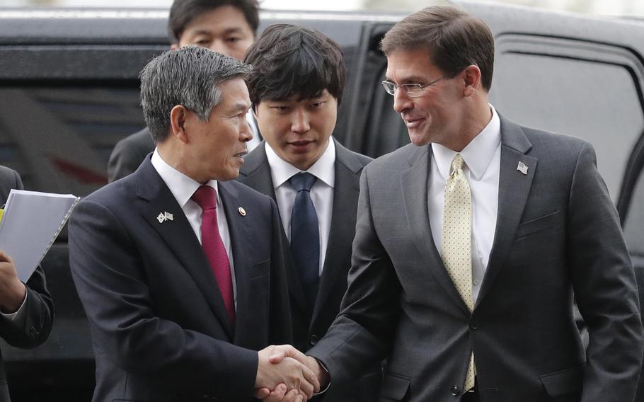 U.S. Defense Secretary Mark Esper, right, talks with South Korean Defense Minister Jeong Kyeong-doo upon his arrival for the 51st Security Consultative Meeting at Defense Ministry in Seoul, South Korea, Friday, Nov. 15, 2019.
