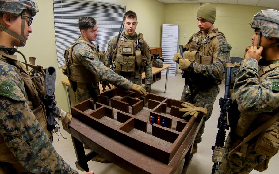 Marines from the Fleet Anti-terrorism Security Team-Pacific, Yokosuka Naval Base, Japan, use a mock-up of the shoot-house to establish a plan for clearing the structure at Story Live Fire Training Complex, South Korea, Tuesday, Nov. 26, 2019.

